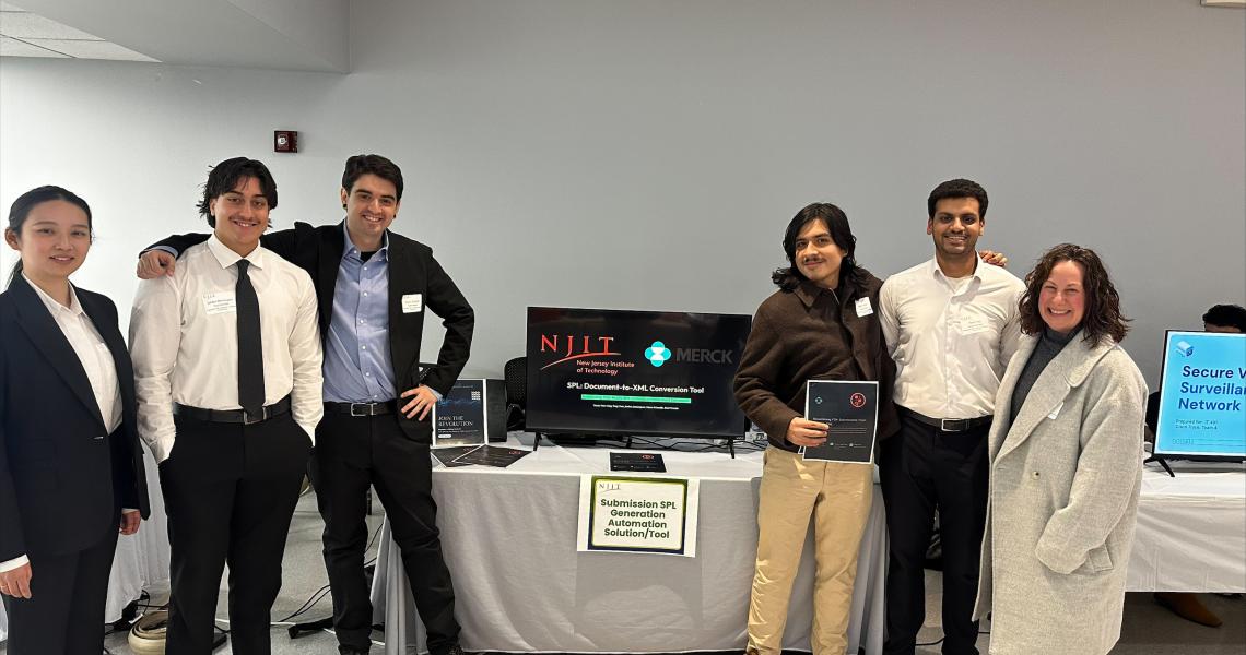 Group of six people at a tech presentation.
