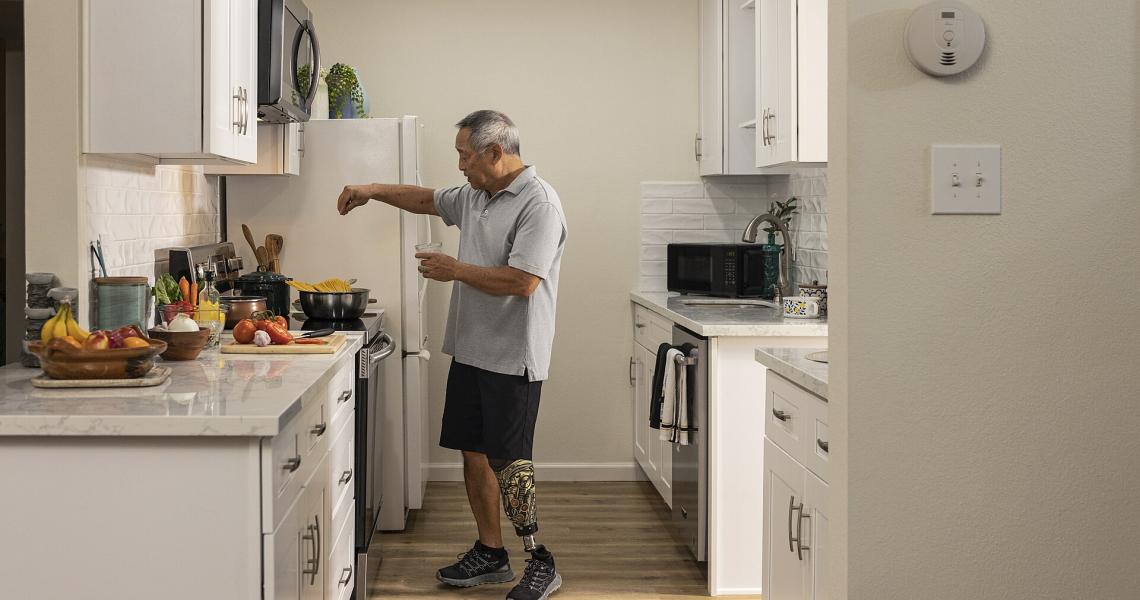 Man cooking in a modern kitchen.